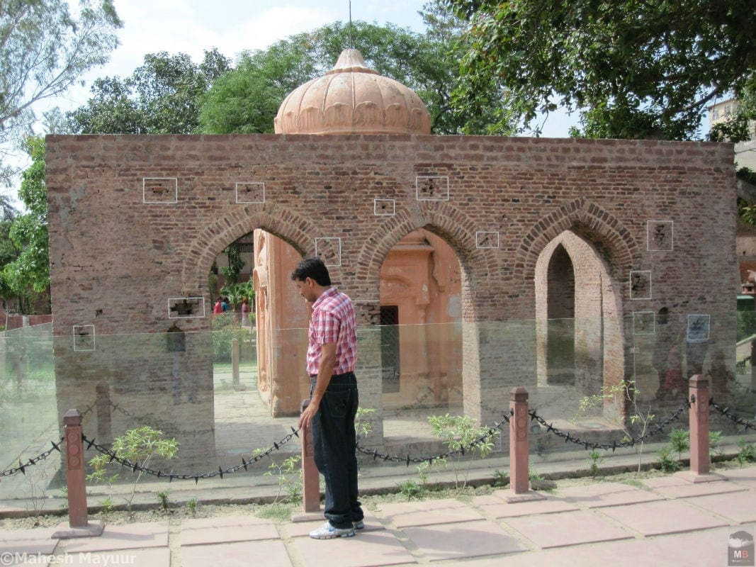A Tourist looks at a monument at the Jallianwala bagh memorial