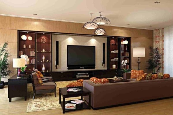 The living room with wall mounted television and cushioned sofa