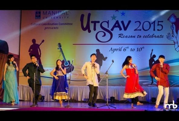 MMMC Students singing in Hindi on stage at Utsav 2015
