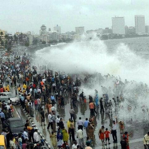 Tourists at Marine drive at high tide
