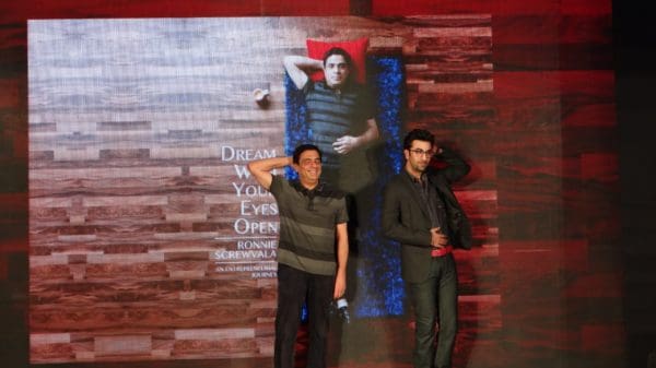 Ranbir kapoor strikes a pose at the launch of the book cover for ronnie screwvala's dream with your eyes open